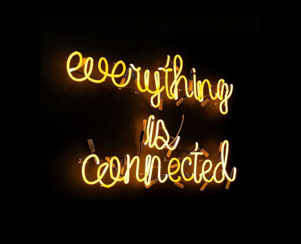 "Everything is connected" quote as a fluorescent light sign