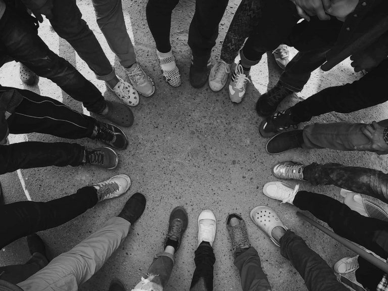 A group of many feet forming a circle