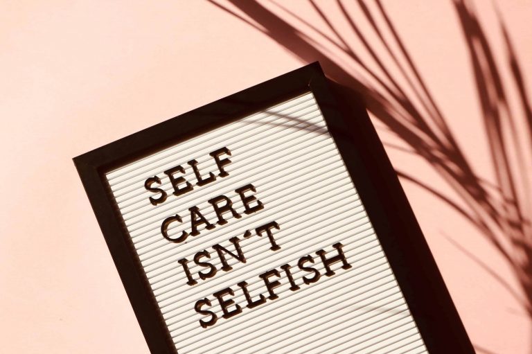 "Self care isn't selfish" quote on a letterboard