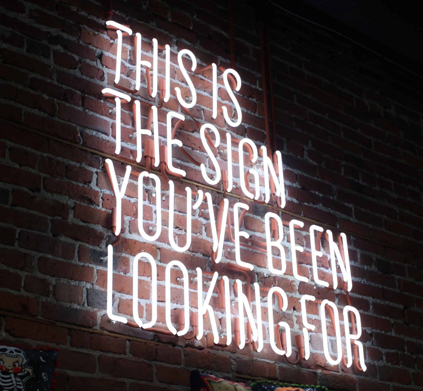 "This is the sign you've been waiting for" quote in fluorescent lights