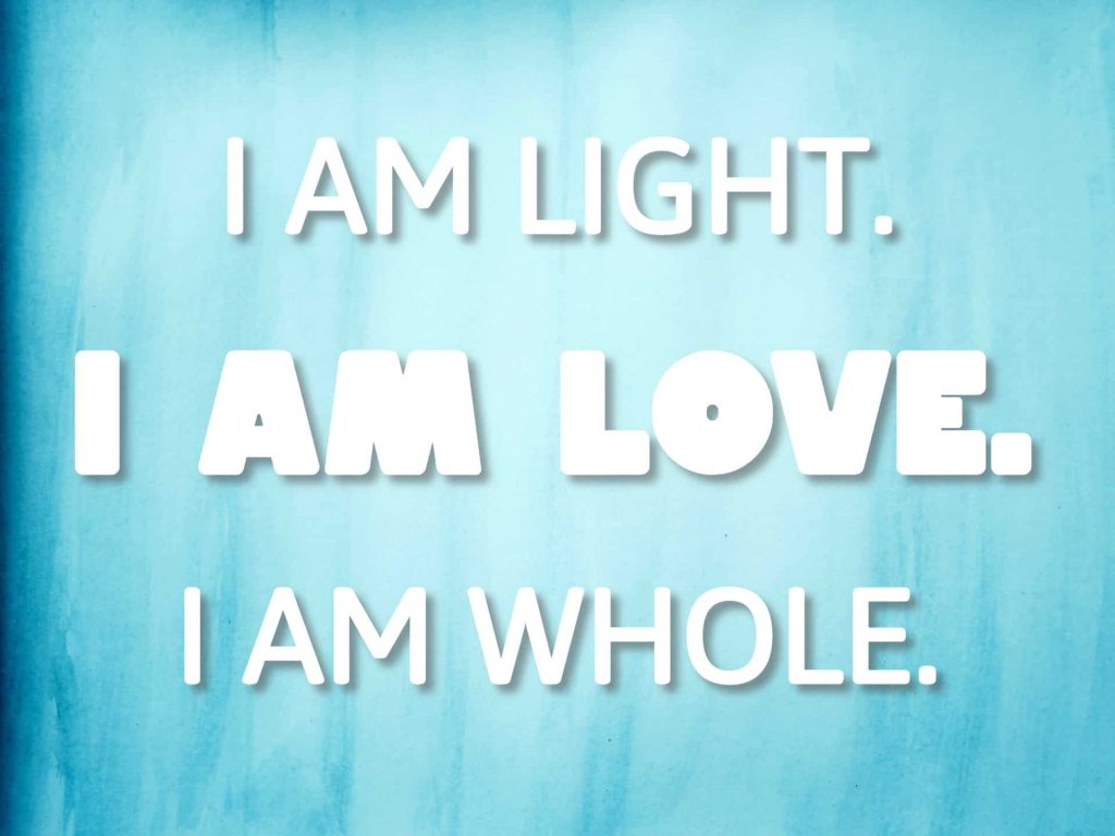 "I am light. I am love. I am whole." quote on blue watercolor background