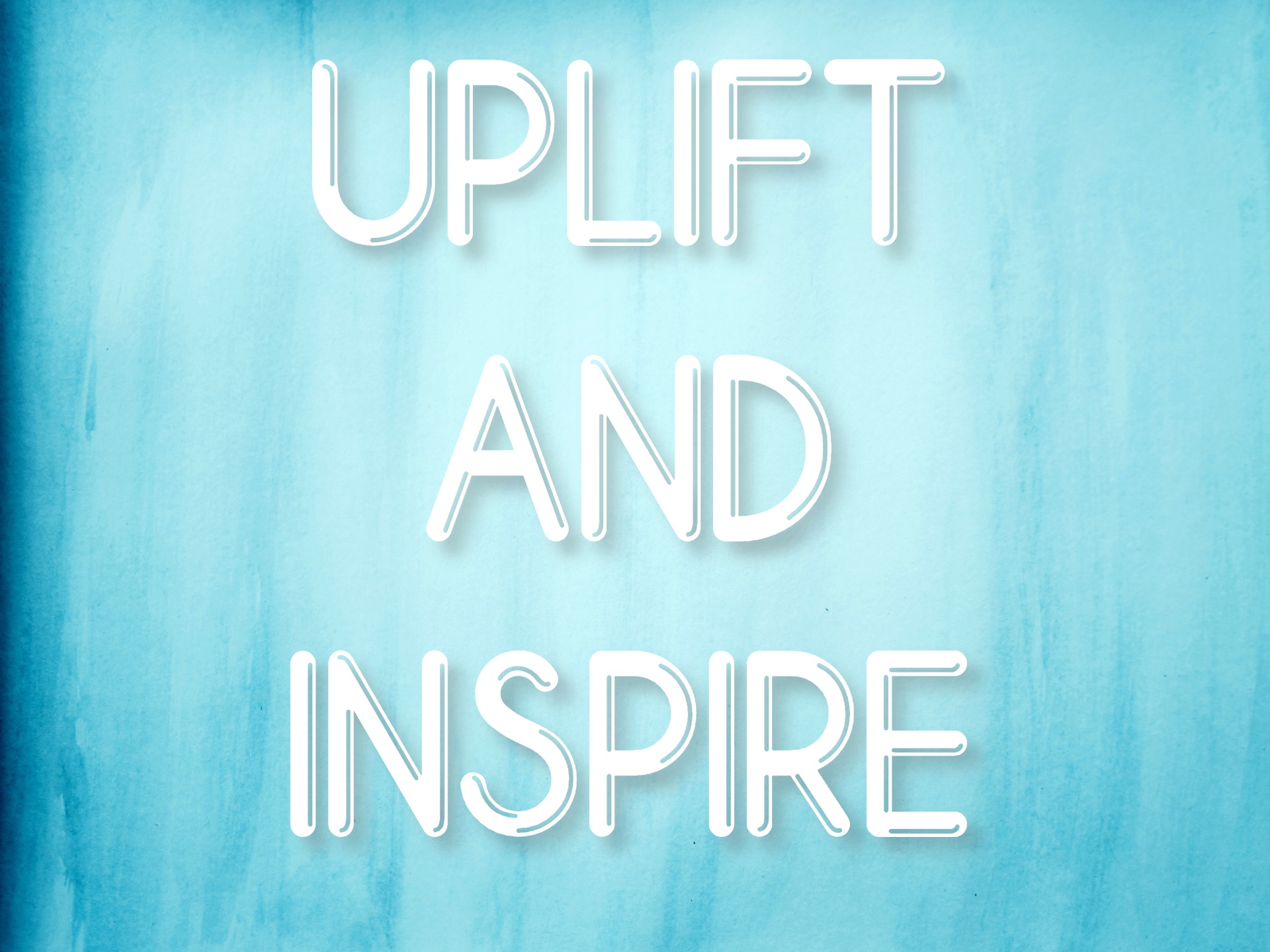 "Uplift and Inspire" mantra over blue watercolor background