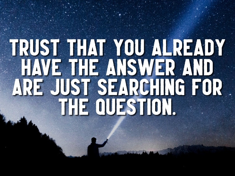 "Trust that you already have the answer and are just searching for the question." quote over a person shining a flashlight up towards the star filled sky
