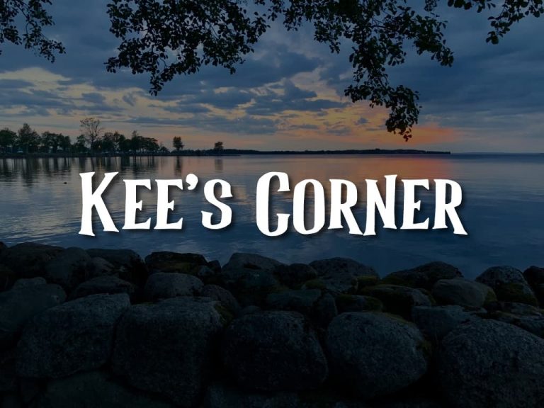 A scenic lake background at sunset with the title "Kee's Corner"