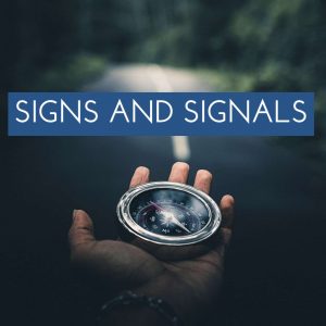 Person holding a compass in their hand