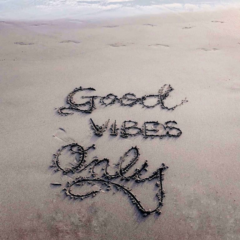 good vibes only quote written in the sand