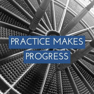 Three thrown darts on a dart board