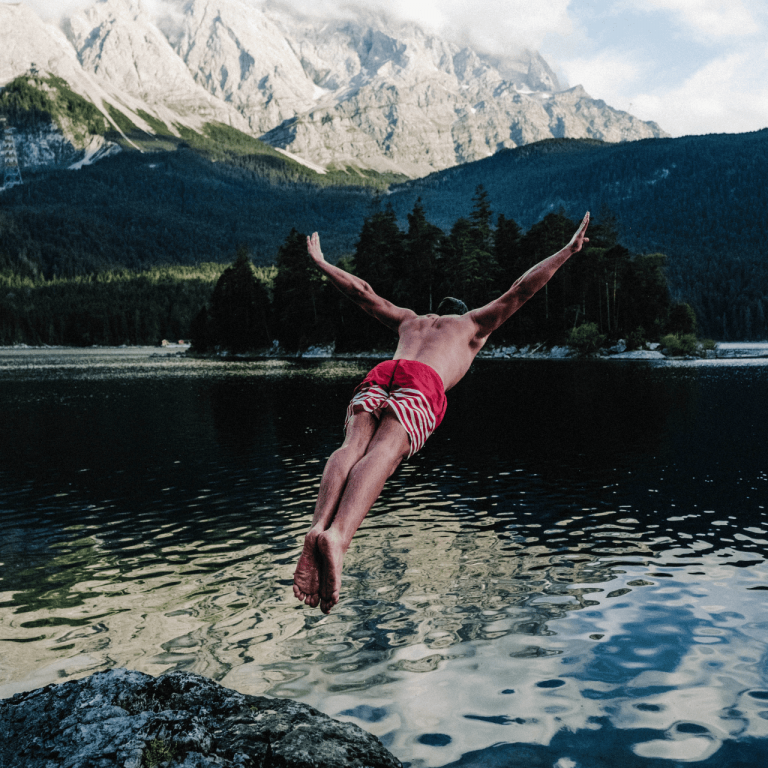 Person diving into the water enthusiastically