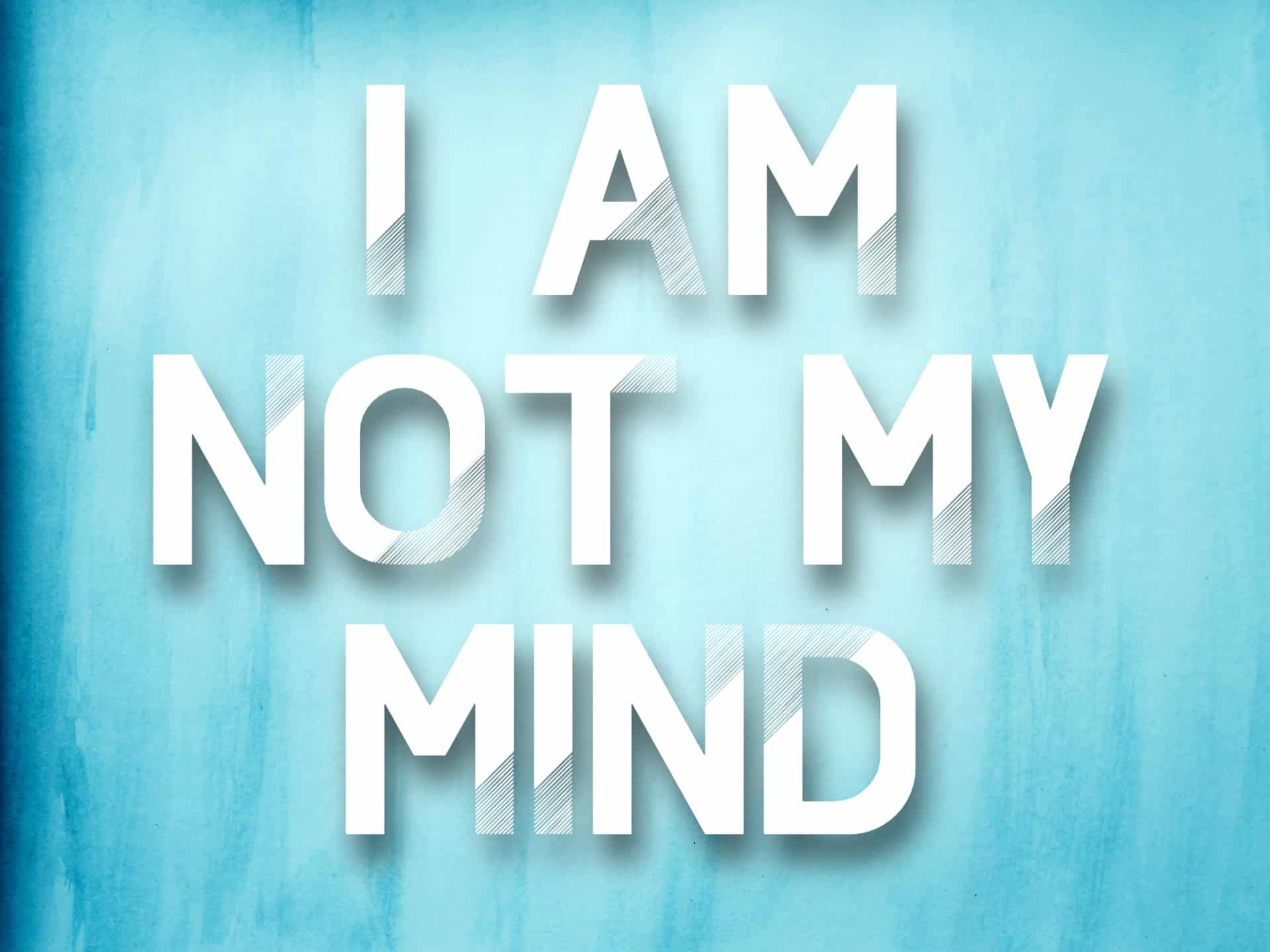 "I am not my mind" mantra on a blue watercolor background