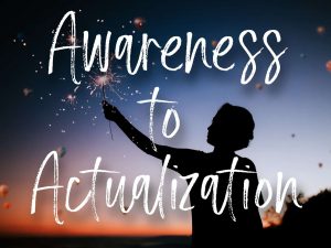 A person standing outside holding a sparkler in the night sky with the words "Awareness to Actualization"