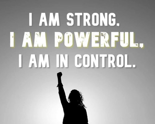 "I am strong, I am powerful, I am in control" quote on a picture of a person with their fist in the air