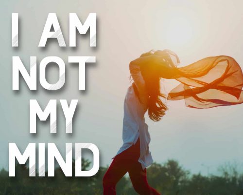 "I am not my mind" mantra over a picture of a woman freely enjoying the sun