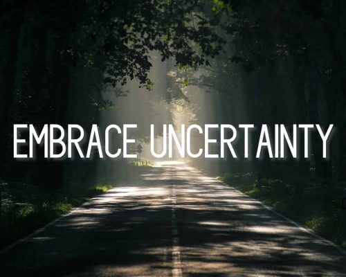"Embrace Uncertainty" quote on a picture of an open road through the trees with sun and shadow